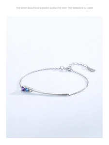 Detail of S925 sterling silver bracelet with colorful zircons and adjustable chain