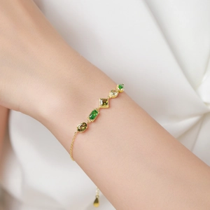 Elegant 925 sterling silver gold chain bracelet featuring five green gradient gemstones