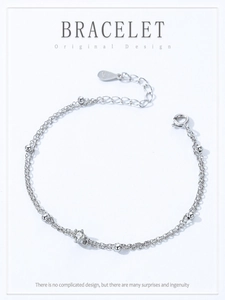 Detail of S925 sterling silver double-layer bracelet with small beads and clear zircon