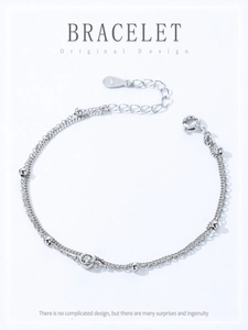 Macro shot of S925 sterling silver double-layer bracelet with round zircon and beads