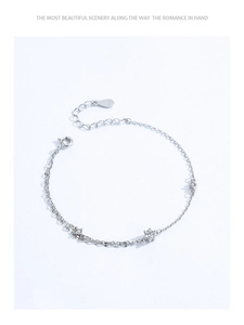Macro shot of S925 sterling silver double-layer chain bracelet with small zircon accents
