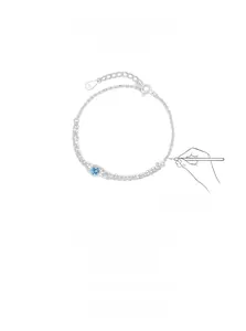 Détail de la double chaîne en argent S925 avec zircon bleu ciel rond et poinçon S925