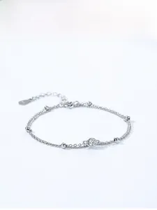 Detail of double-layer S925 silver beaded bracelet with bezel-set round white zircon