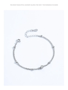Detail of S925 sterling silver double-layer bead chain bracelet with a sparkling zircon