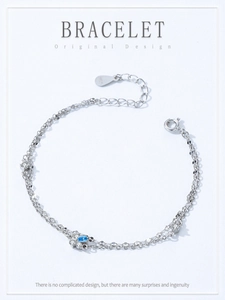 Detail view of 925 silver double-layer bracelet with blue pear-cut zircon stone