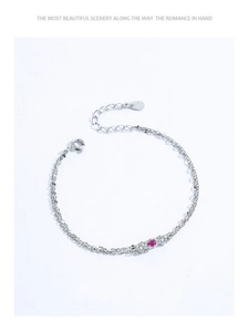 Detailed macro view of S925 sterling silver double-layer bracelet with ruby red zirconia