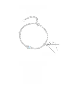 Macro detail of S925 sterling silver stamp on a double-layer chain bracelet