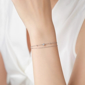Double-layered 925 sterling silver beaded bracelet with sparkling central zircon stone
