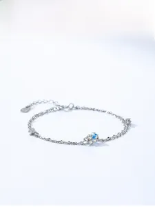 Detail of 925 sterling silver bracelet featuring a light blue flower and double layer chain