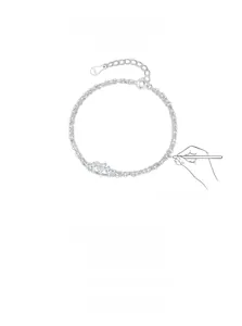 Détail du bracelet double couche en argent S925 avec pendentif cœur et zircon