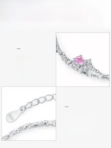 Macro detail of S925 sterling silver chain with 5A pink zircon and hallmarked metal tag