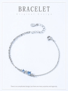 Detailed view of S925 sterling silver bracelet with ice blue and clear cubic zirconia