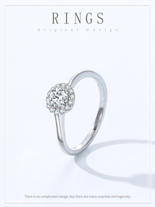 Macro detail of 925 silver halo ring with brilliant round zircon and elegant pavé setting