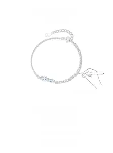 Detail of S925 sterling silver chain with blue gems and logo tag showing S925 hallmark
