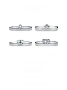 Macro detail of S925 sterling silver rings with various geometric zircon cuts on white background