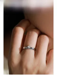 Close-up of S925 silver ring featuring square zircon stone worn on model hand
