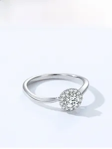 Detail of 925 sterling silver halo ring with round zircon flower cluster setting