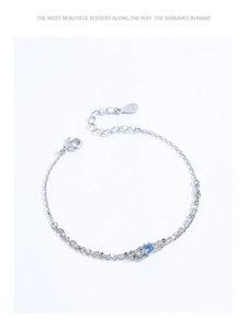 Detail of S925 sterling silver double-layer bracelet with blue zircon and S925 hallmark