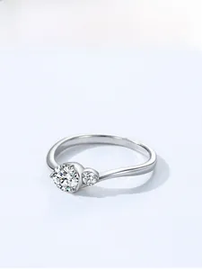 Detail view of S925 sterling silver wave ring with two sparkling round zircon stones