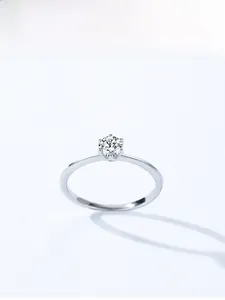 Macro view of classic six-prong solitaire ring with a round-cut sparkling cubic zirconia