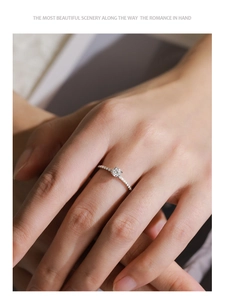 Detailed view of an S925 sterling silver ring with a classic four-prong round zircon setting