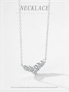 Macro shot of S925 sterling silver necklace featuring five V-shaped set zircons