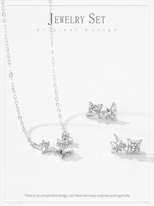 Macro detail of S925 sterling silver four-point star jewelry set with pavé cubic zirconia
