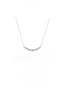 Macro detail of S925 sterling silver curved necklace featuring seven sparkling zircon stones