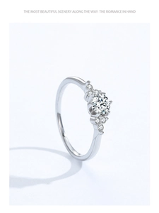 Detail of a 925 sterling silver engagement ring with six-prong set center stone