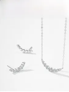Detailed display of S925 silver curved diamond necklace and matching stud earrings set
