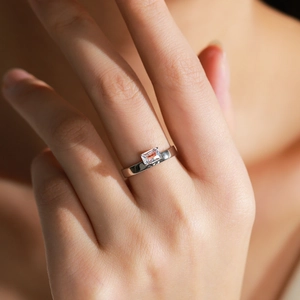 Elegant S925 sterling silver ring with emerald cut zircon stone worn on a female hand