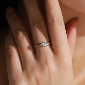 Elegant 925 sterling silver geometric ring with bright round diamond on model's finger