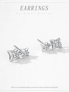 Macro detail of S925 sterling silver star stud earrings with sparkling zircon stones