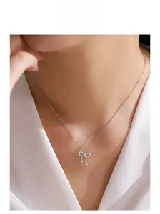 Exquisite S925 sterling silver bow necklace with sparkling zircon crystals on model