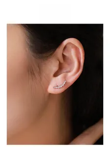 Close-up of S925 sterling silver ear crawler with gradient crystals on model