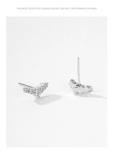 Close-up of S925 sterling silver V-shaped stud earrings featuring five sparkling zircon stones