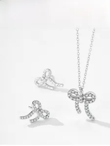 Detailed set of S925 sterling silver bow pendant necklace and matching stud earrings