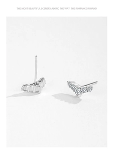 Macro view of S925 sterling silver V-shaped studs with sparkling zircon stones