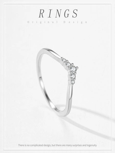Macro detail of S925 sterling silver V-shaped ring with five sparkling zircons