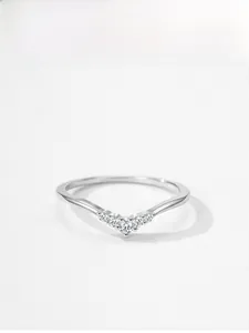 Macro detail of S925 sterling silver V-shaped ring with five brilliant zircons