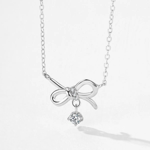 Elegant S925 sterling silver bow pendant necklace with a brilliant round cut stone
