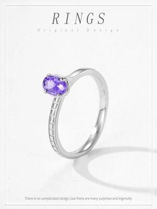 Detailed macro view of an S925 silver ring featuring an oval purple zircon gemstone