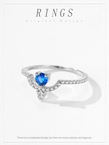 Macro shot of S925 silver crown ring with blue zircon and brilliant round cut gemstone