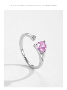 Detail of S925 silver open ring featuring a pink heart-shaped stone and cubic zirconia