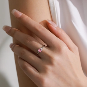 Fashion S925 sterling silver ring with pink zircon and side stones on female hand