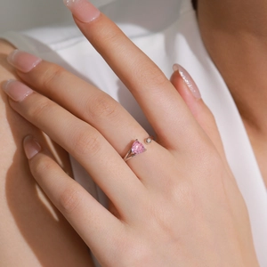 S925 sterling silver ring with pink heart stone and side diamond on female model