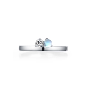 Elegant 925 sterling silver ring featuring a round diamond and a blue moonstone gem