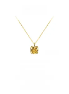 Macro shot of luxury rose-cut yellow citrine pendant on a gold S925 sterling silver chain