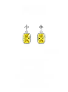 Detail of S925 silver earring with radiant cut yellow zircon and star crystal