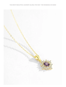 Detailed macro of gold necklace with rectangular purple gem surrounded by pavé diamonds